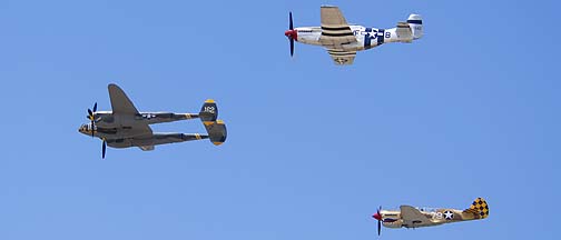 Curtiss P-40N Warhawk NL85104, P-38J Lightning NX138AM 23 Skidoo, and P-51D Mustang NL5441V Spam Can